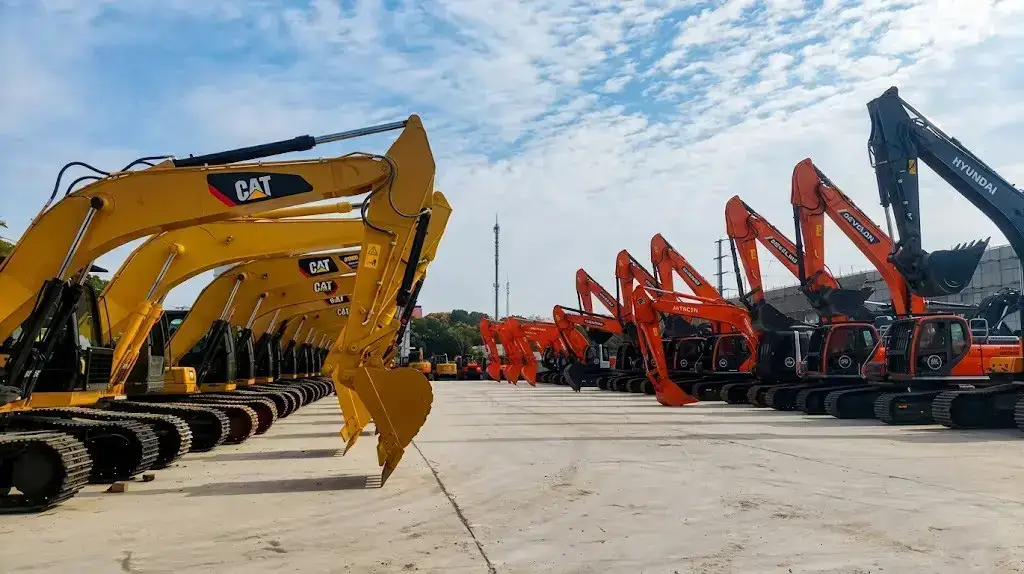 Used excavators in a China export yard ready for buyer inspection